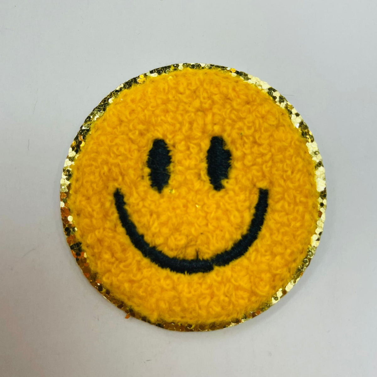 Parche adhesivo autoadhesivo con cara sonriente