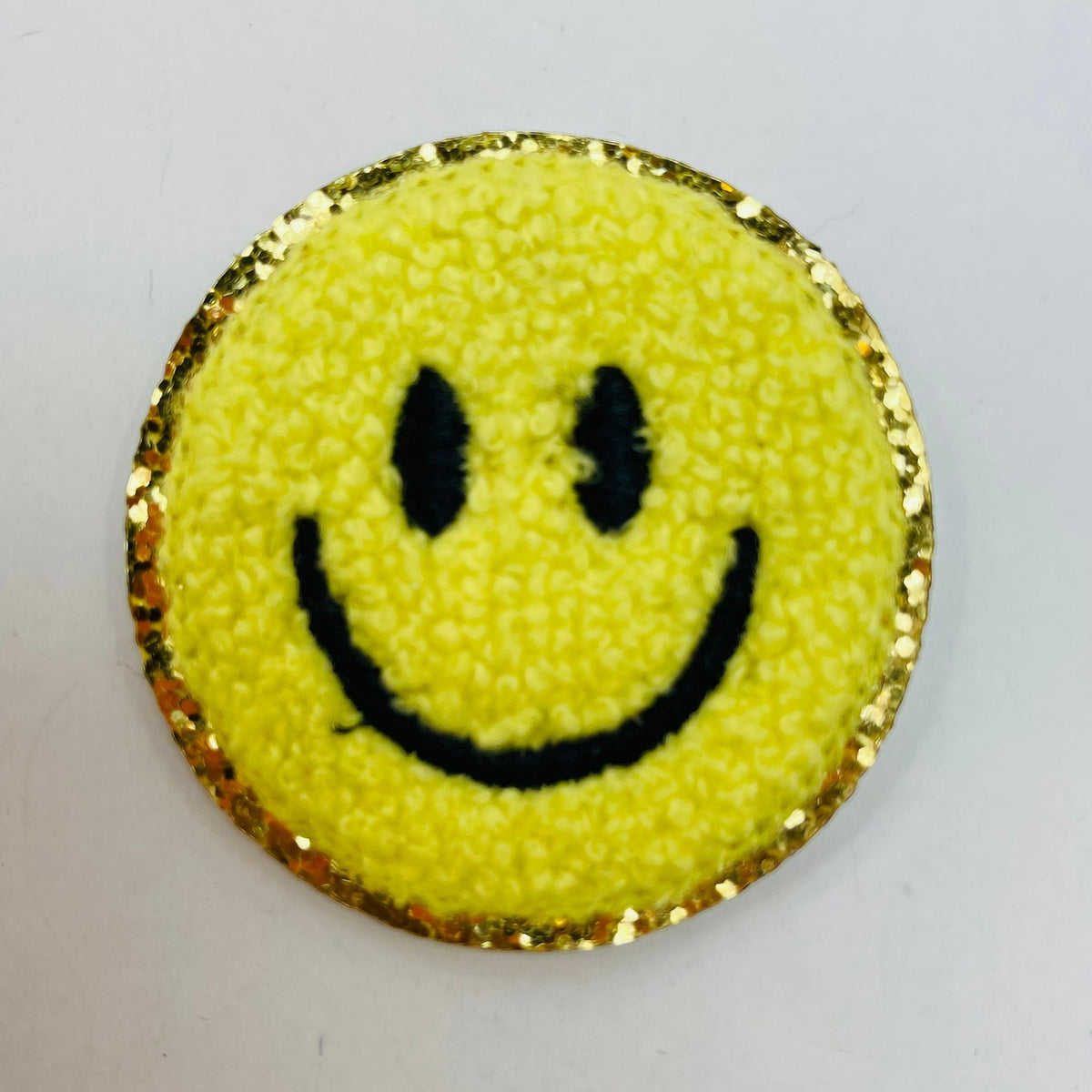 Parche adhesivo autoadhesivo con cara sonriente
